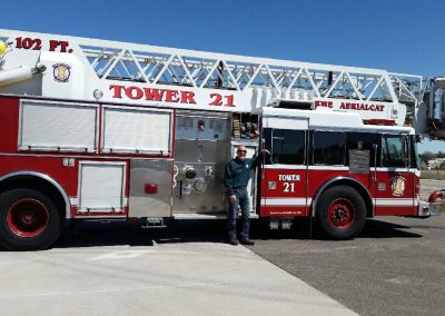 Laramie County Fire District #2 Tower 21, a 102-foot KME AerialCat aerial tower fire truck, is shown as an example of FEPP equipment in service